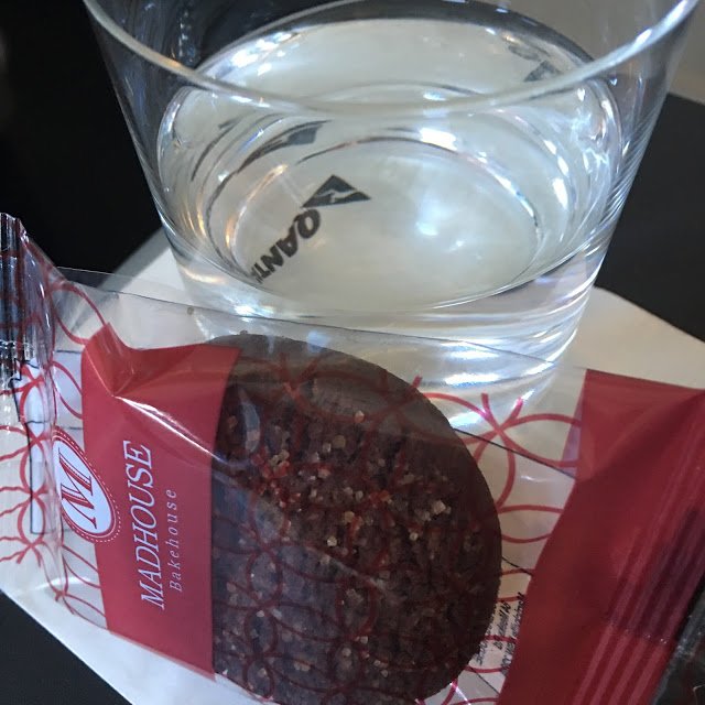 a glass of water and a cookie