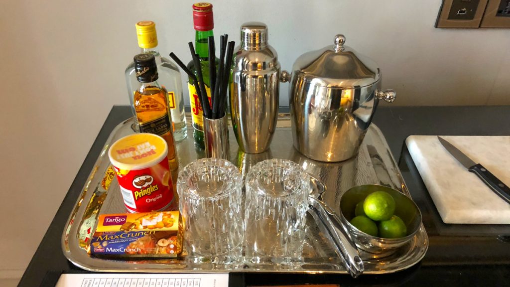 a tray with a drink and glasses on it
