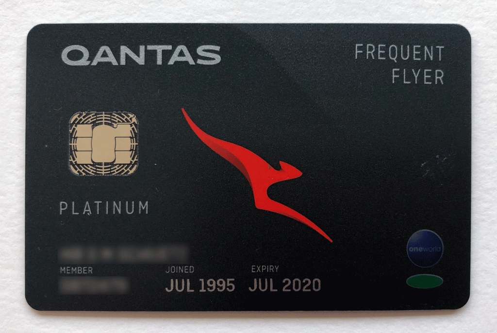 a black credit card with a red logo