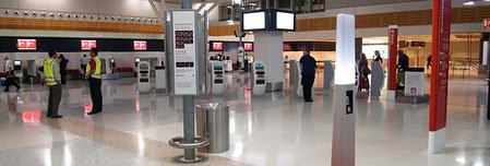 a man standing in a large airport