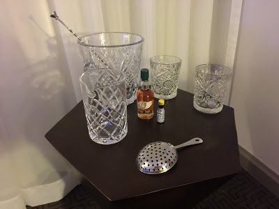 a table with glasses and a strainer