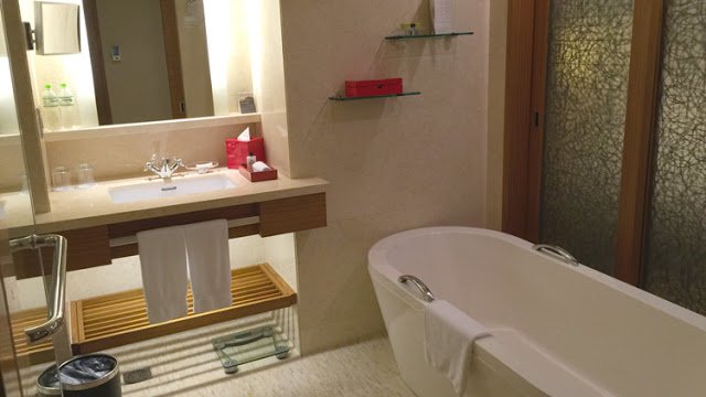 a bathroom with a tub and sink