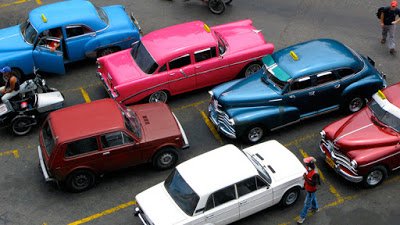 a group of cars parked in a parking lot