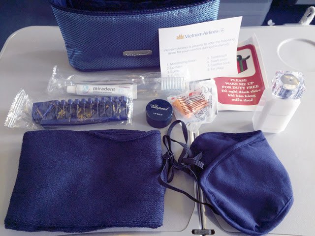 a blue bag with a bag and a mask