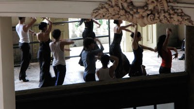 a group of people dancing in a room