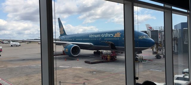 a large blue airplane on a tarmac