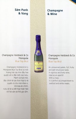 a menu with a bottle of champagne