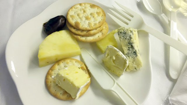 a plate of cheese and crackers