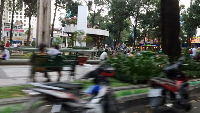 a blurry image of people riding motorcycles