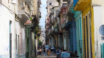 a street with buildings and people walking