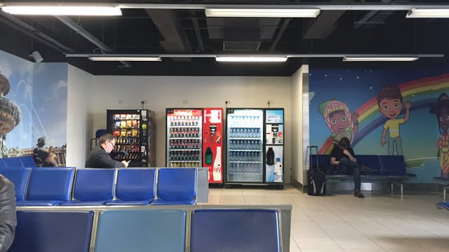 a group of people sitting in a waiting room