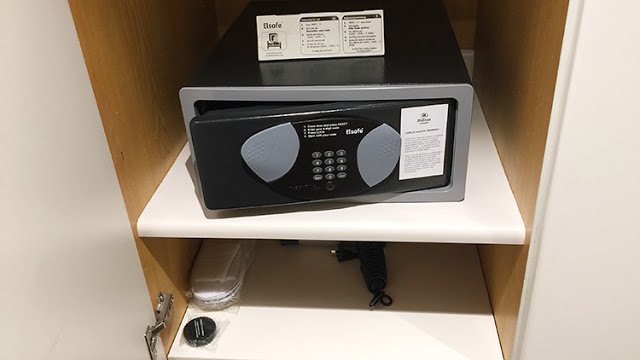a black and grey safe on a shelf