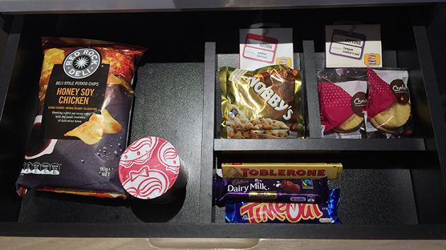 a shelf with food items in it