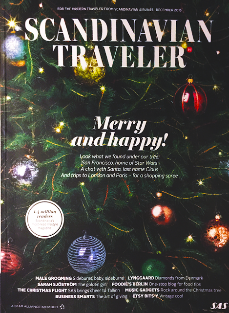 a magazine cover with a tree with ornaments