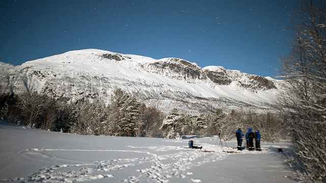 a group of people in the snow