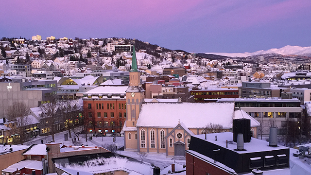 a city with snow on the ground