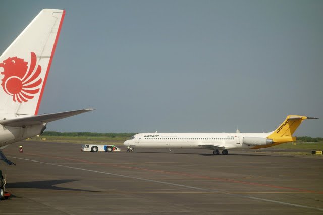 a white airplane on a runway