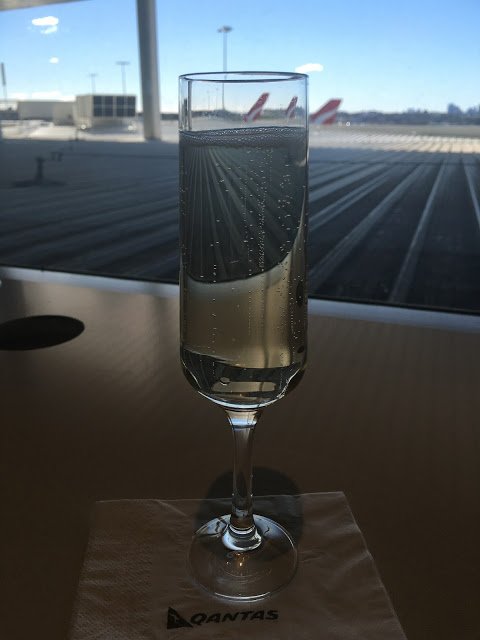 a glass of water on a napkin