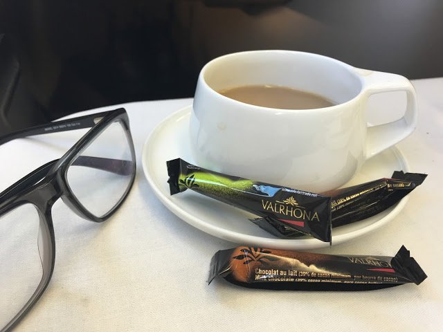 a cup of coffee and some chocolates