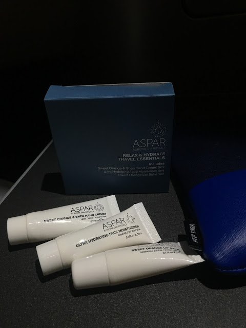 a group of white tubes next to a blue box