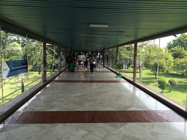 a group of people walking in a building