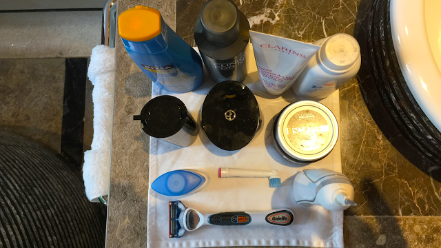 a group of personal hygiene items on a towel