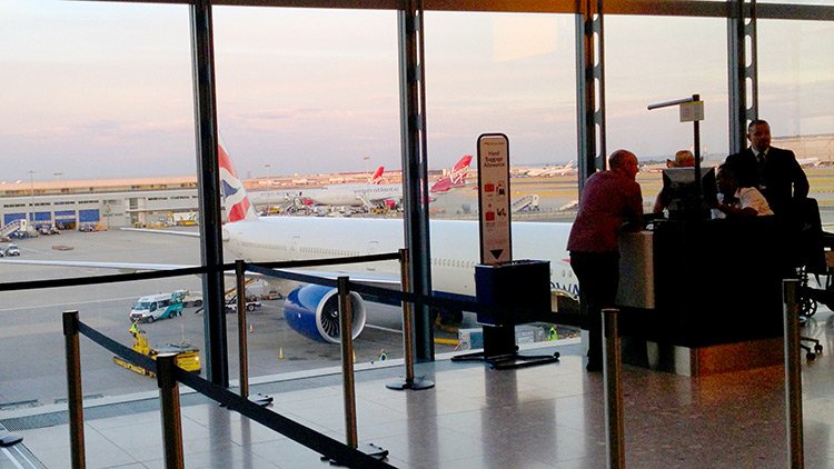 a man standing in front of an airplane