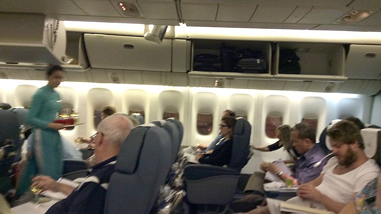 a group of people sitting in an airplane