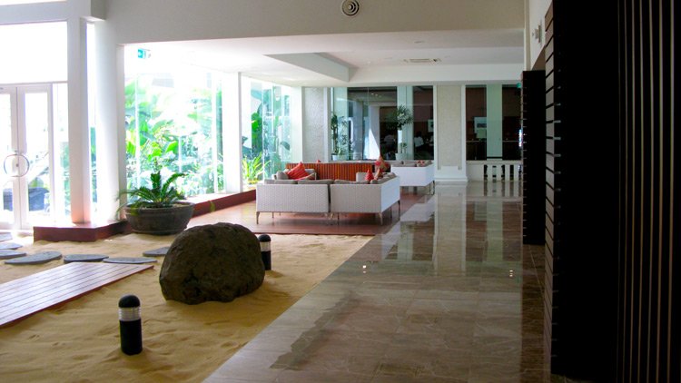a room with a large rock in the middle