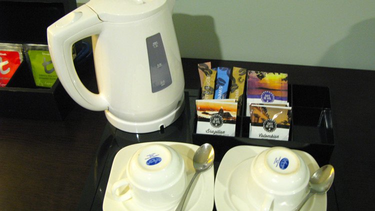 a teapot and teacups on a table