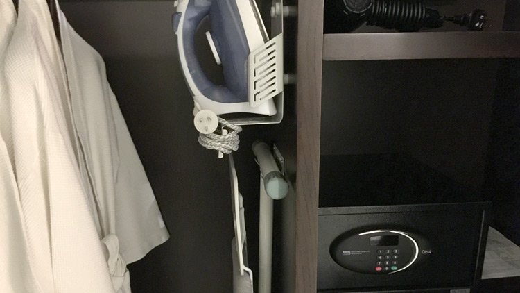 an ironing board in a closet