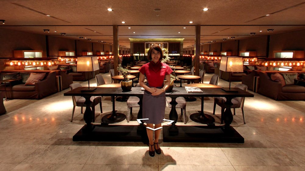 a woman standing in a restaurant