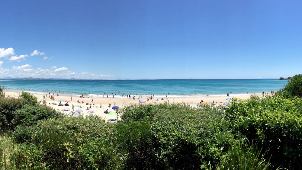 a beach with people on it