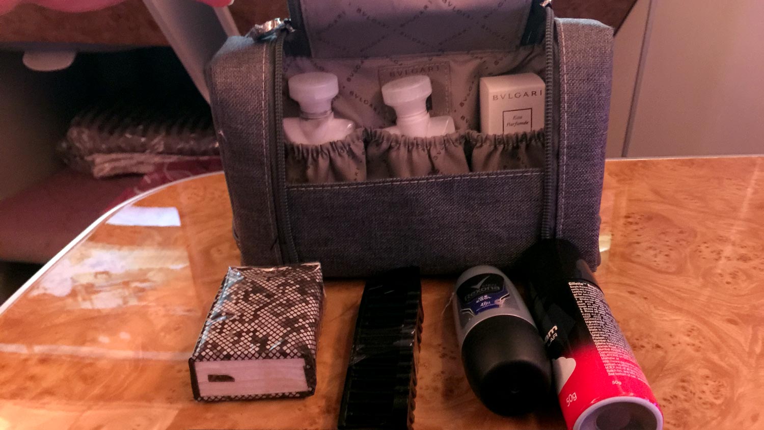 a bag with a few bottles of cosmetics