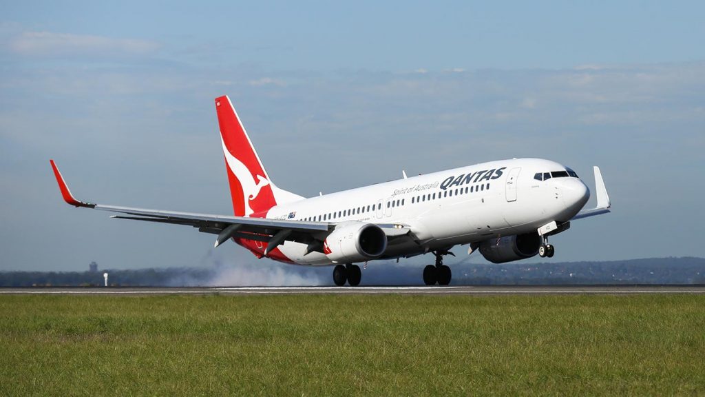 a white airplane on a runway