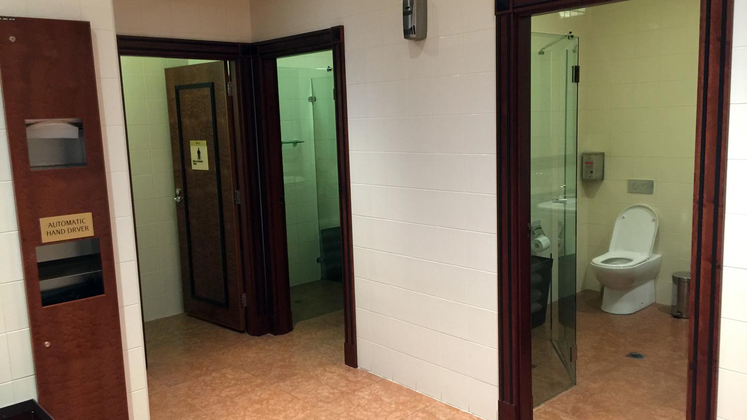 a bathroom with a shower stall and a toilet