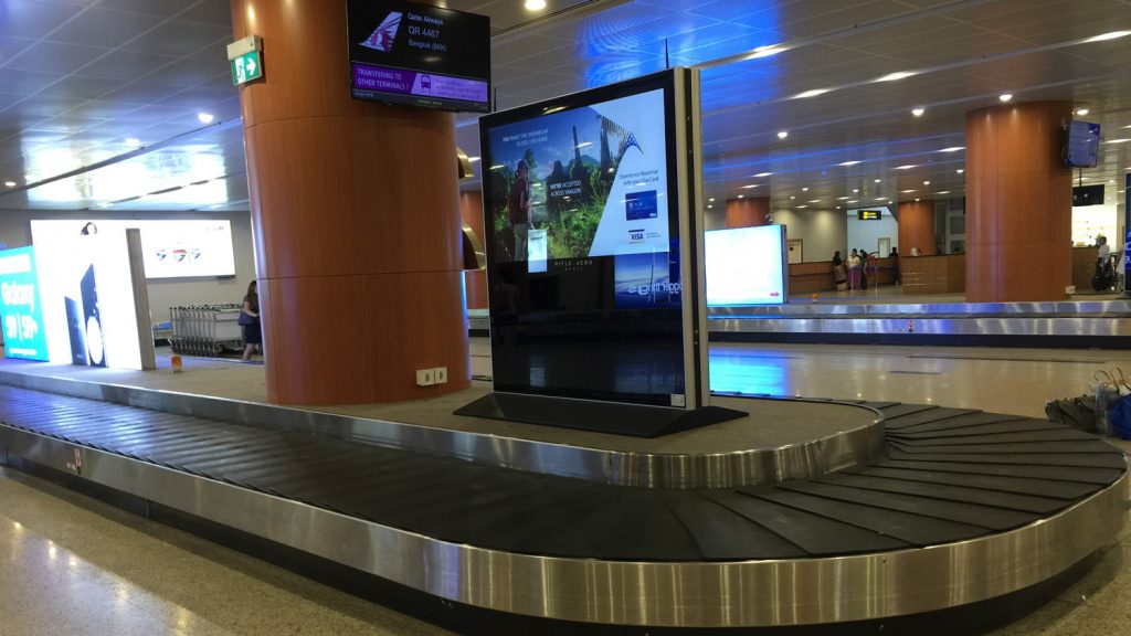 a large screen on a conveyor belt