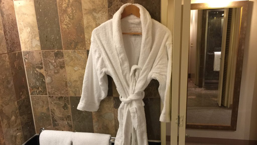 a white bathrobe on a swinger