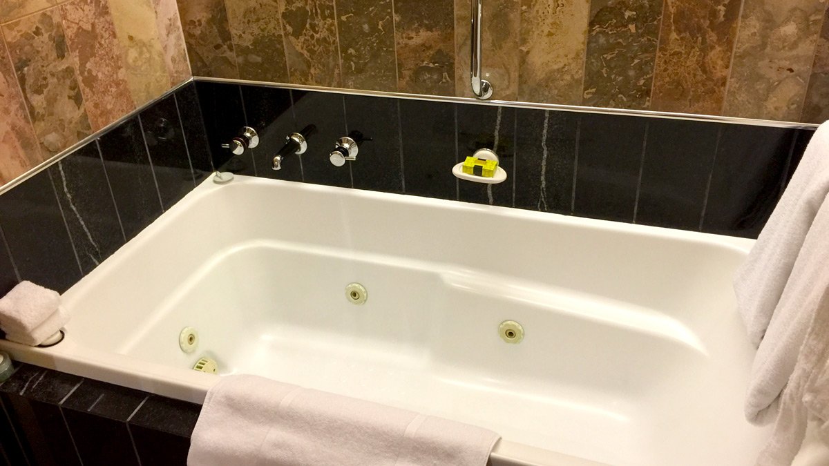 a bathtub with a towel on it