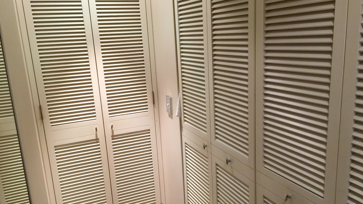 a row of white closet doors