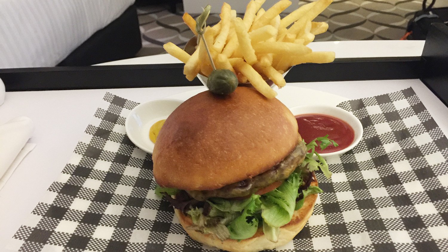 a burger with fries on top