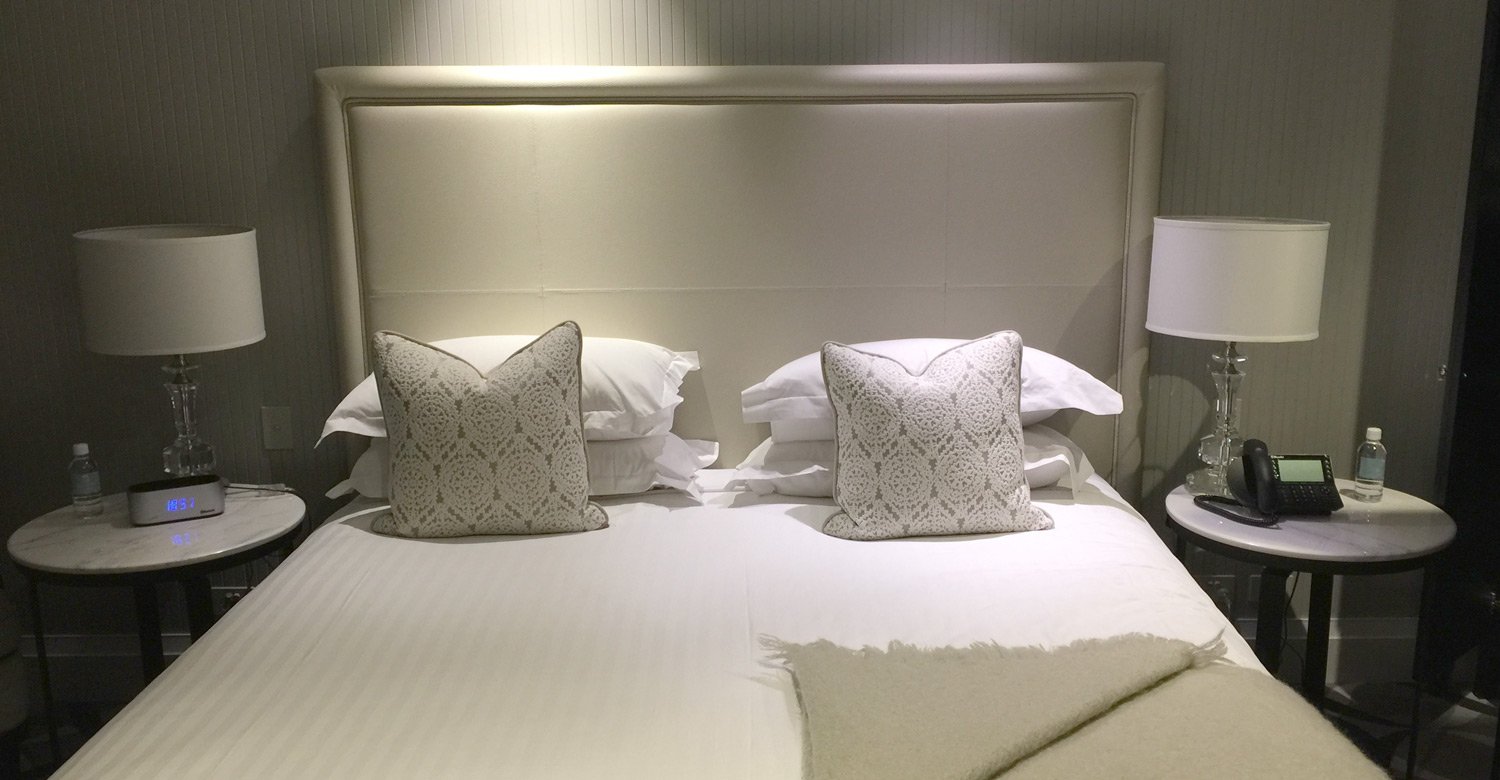 a bed with pillows on it