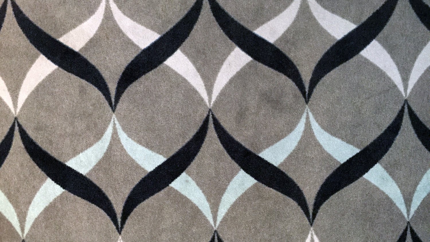 a grey and black patterned carpet