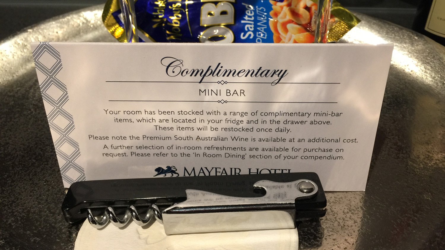 a hotel sign with a bar and a bag of snacks