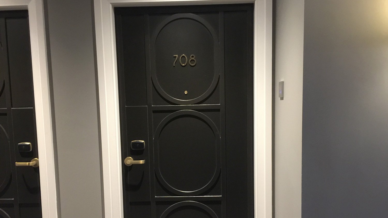 a black door with a gold handle