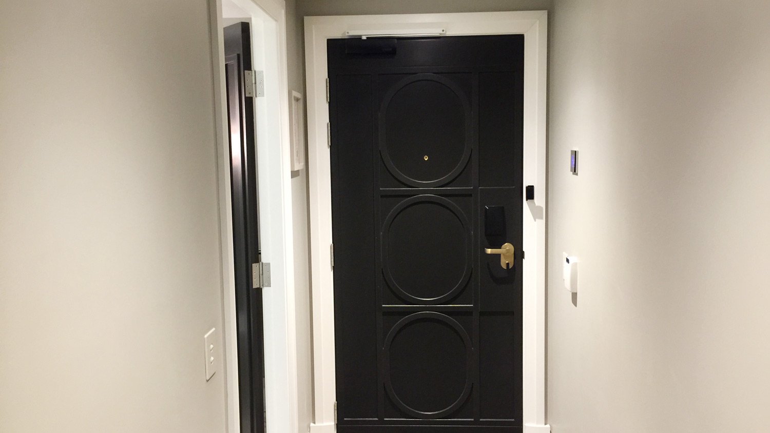 a black door with a gold handle