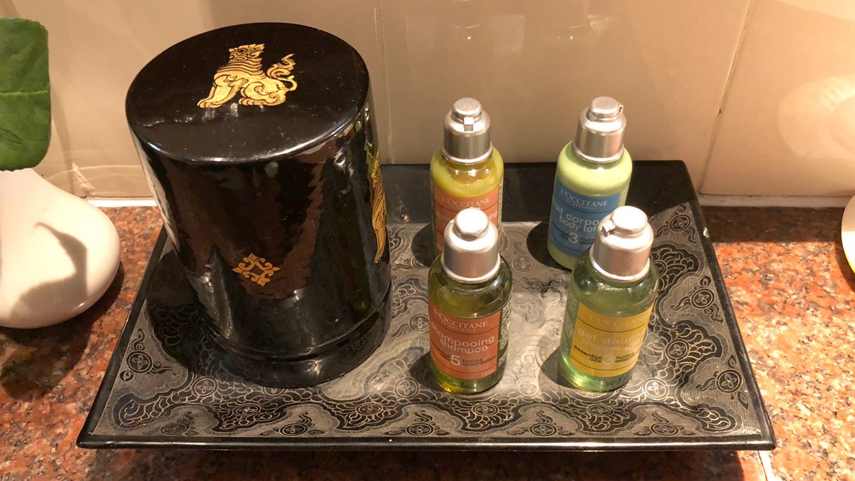 a group of bottles of shampoo and hair conditioner on a tray