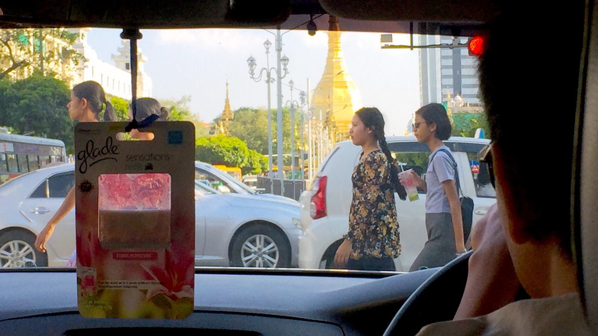 a group of people walking on a street