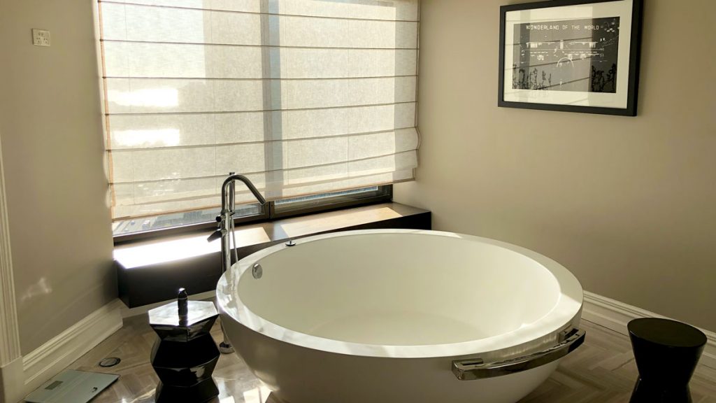 a white bathtub in a bathroom