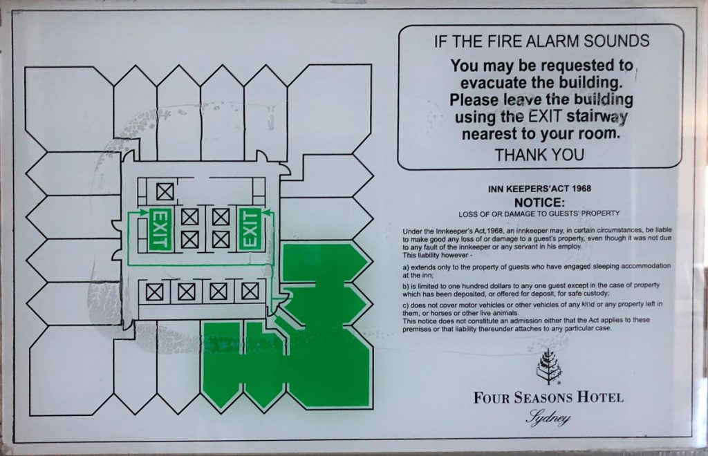 a sign with a diagram of a fire alarm